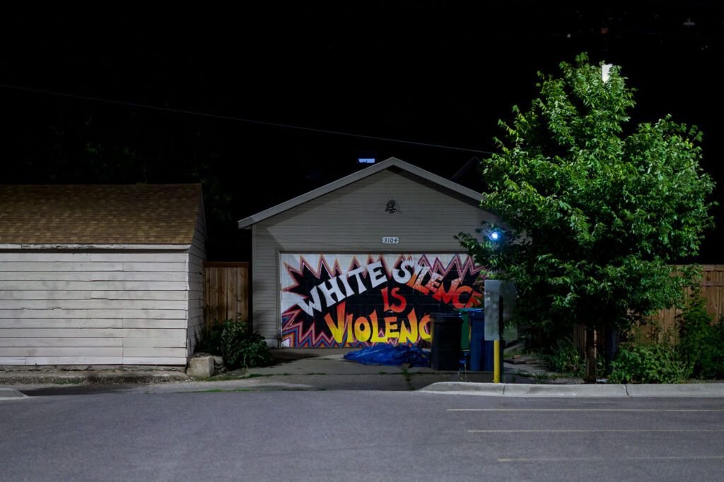 A mural in South Minneapolis reading "White Silence is Violence"