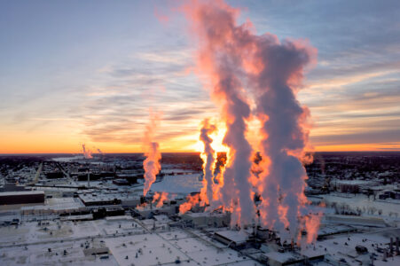 Steam rises from a Procter & Gamble plant in Green Bay, WI
