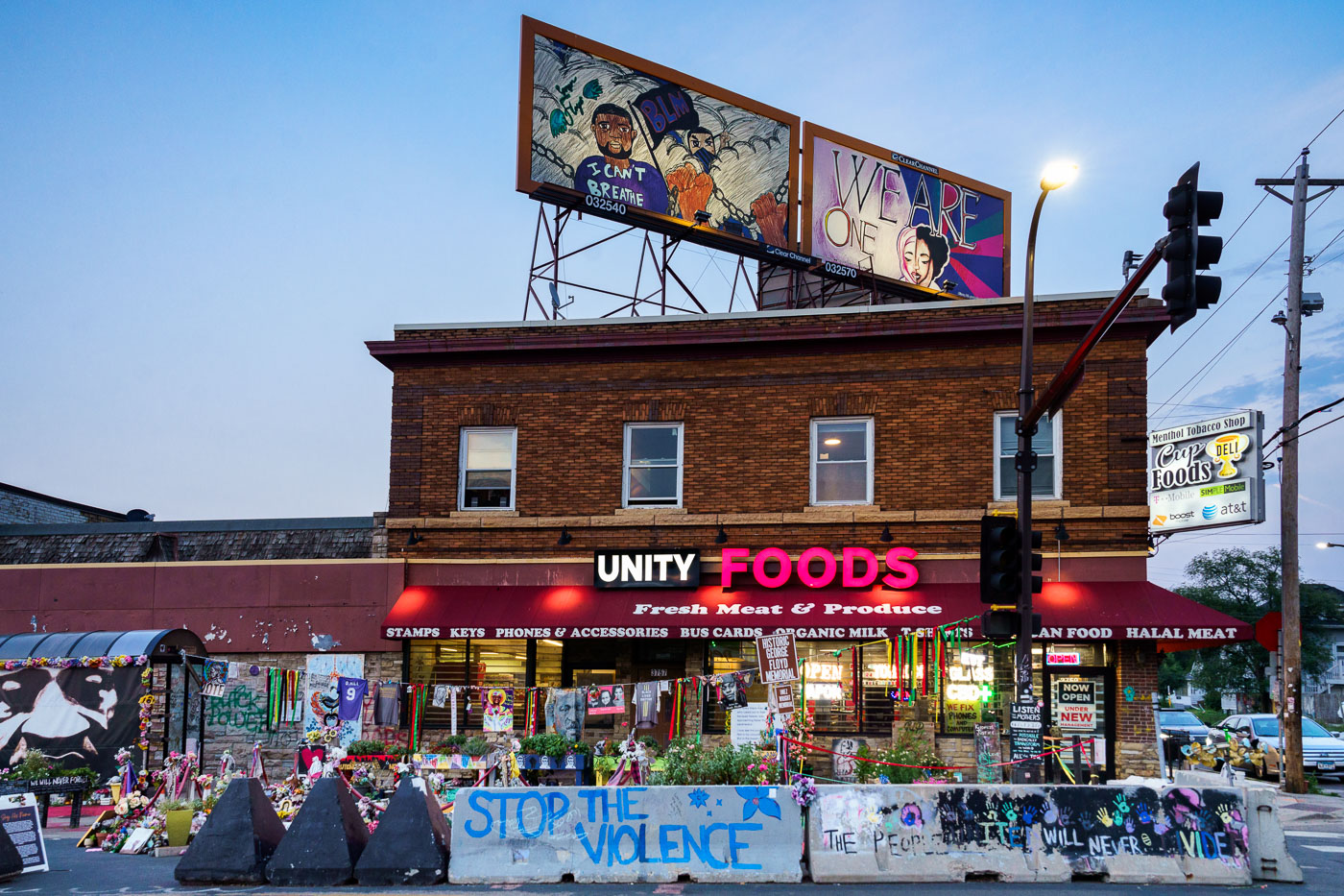 2 art billboards over Unity Foods in Minneapolis