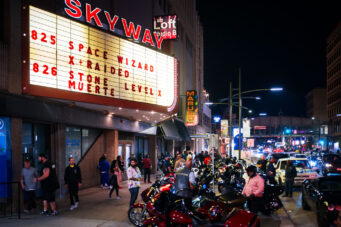 Motorcycles and hot rodders outside the Skyway Theatre in Downtown Minneapolis.