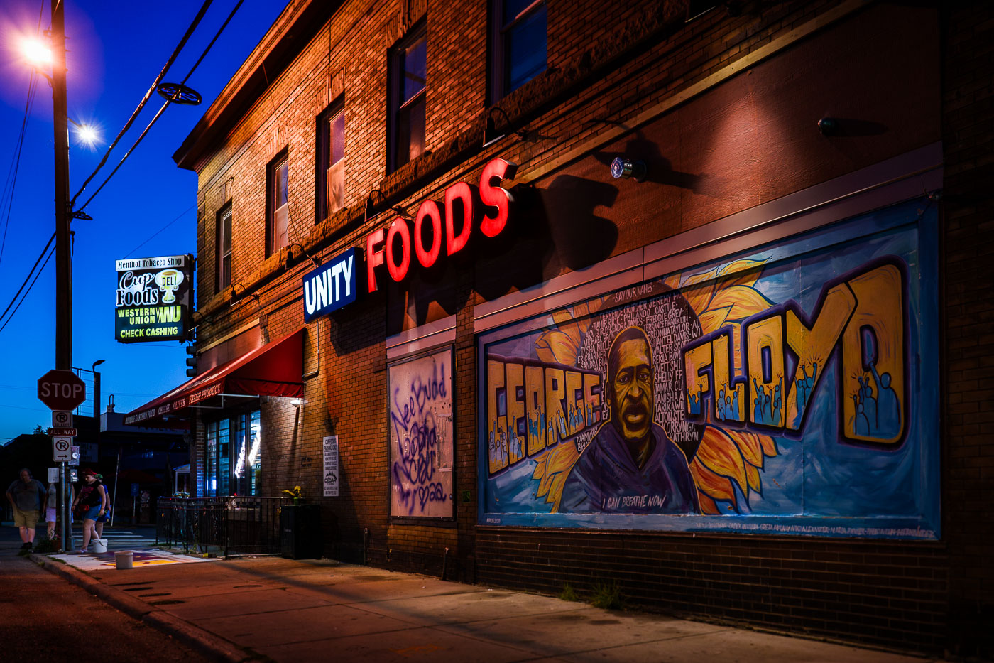 Unity Foods sign above George Floyd mural