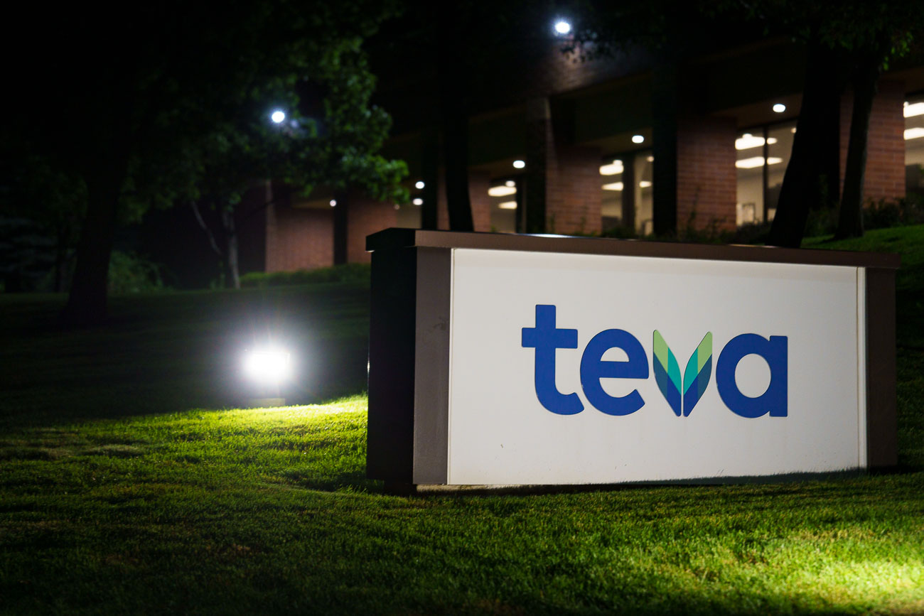 Night photo of a Teva Pharmaceuticals sign