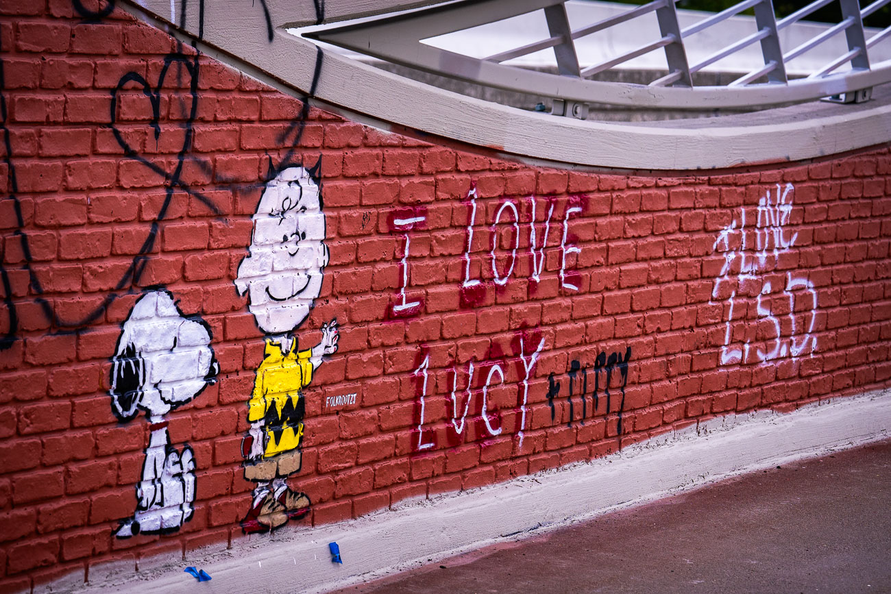 Snoopy and Charlie Brown graffiti on a bridge