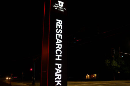 A sign reading "University of Utah" "Research Park" as seen in September 2023 in Salt Lake City, Utah.