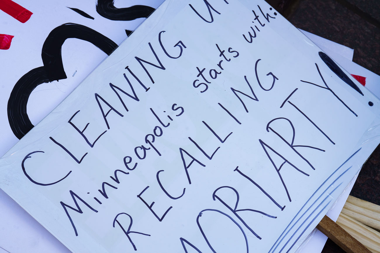 Protest signs for recalling Mary Moriarty