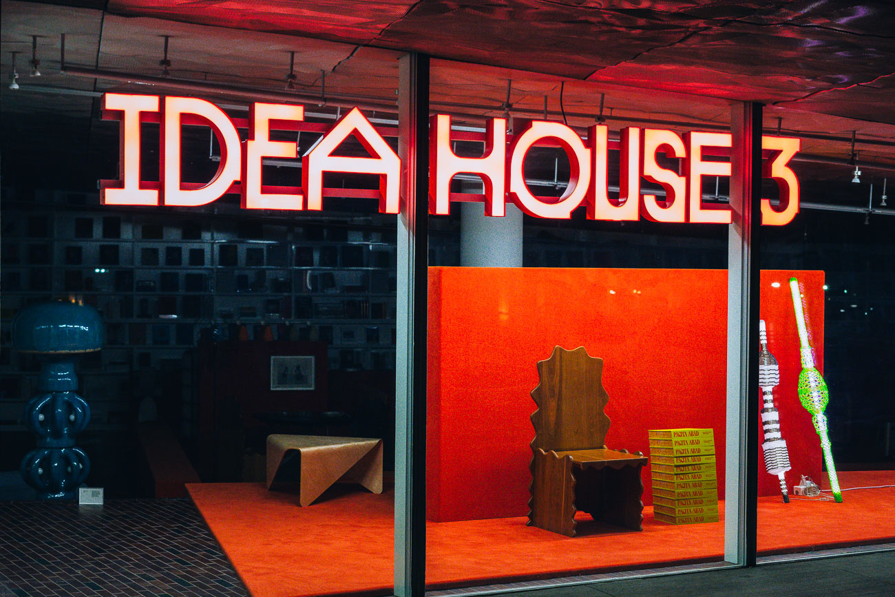 Store front with IDEA HOUSE 3 lit up inside
