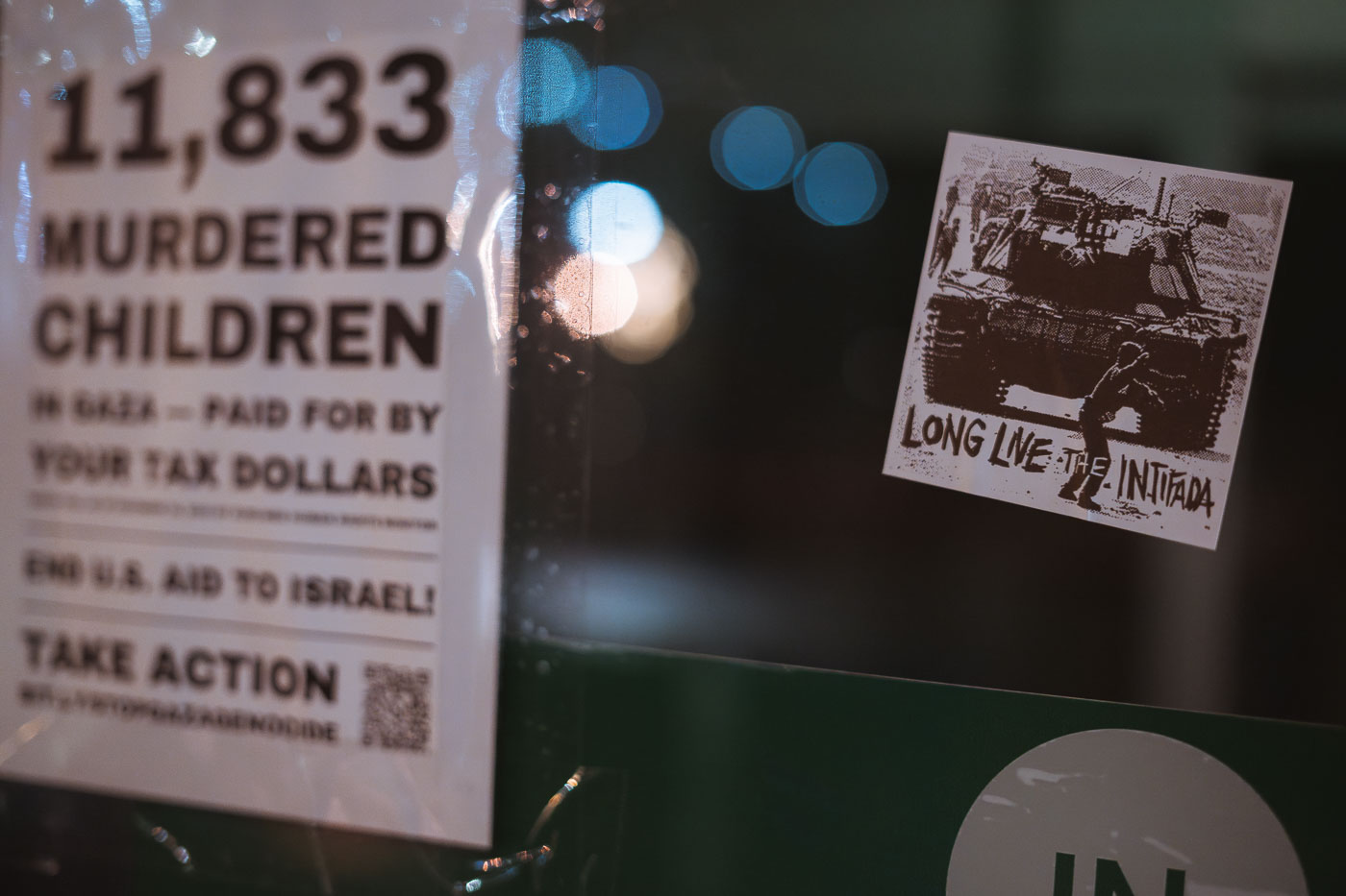 A sticker reading "Long live the intifada" on a Uptown Minneapolis storefront. January 2024.