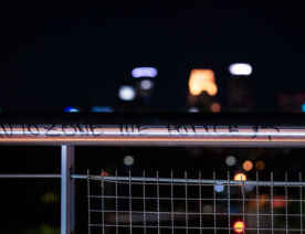 The Martin Olav Sabo bridge over Haiwatha Ave with "Autozone the police" written on it.