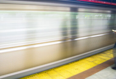 A man reads a book at a New York City subway platform in May 2005.