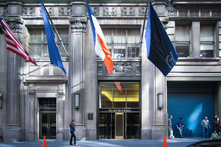 The New York Times headquarters entrance, West 43rd Street 2 The New York Times headquarters entrance on West 43rd Street in Manhattan with flags above the doorway.