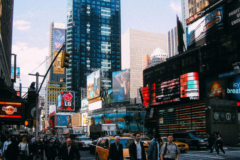 Times Square 1 Yellow cabs and people walking in Manhattan in May 2005.