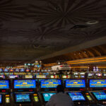 A man plays slot machines at a Las Vegas casino.