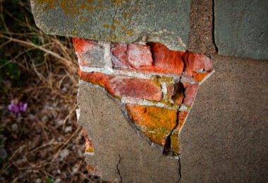 Burick under concrete on an abandoned Church.