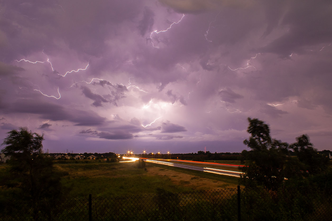 Lightning in Minnesota skies over highway