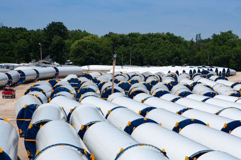 Vestas Wind Turbine Tower Sections near Ashland Avenue 2 Vestas wind turbine tower sections are stored in rows at a rail yard near Ashland Avenue.