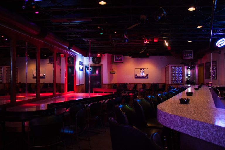 Body Shop Stage and Bar Interior, Green Bay 1 Body Shop strip club interior in Green Bay with bar seating and a small stage.