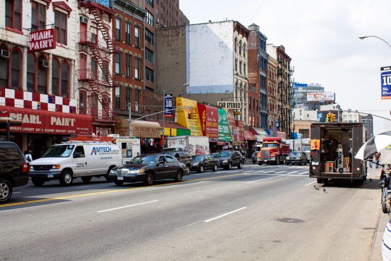 Canal Street Shops in New York City 4 Shops on Canal Street in New York City as a UPS truck drops off packages.