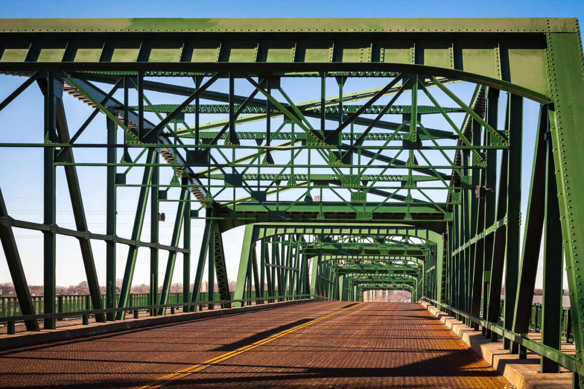 Originally built in 1905 with substantial repairs done over the years, the Lowry Avenue Bridge was closed on April 25, 2008. Controlled explosions demolished it on June 21, 2009.