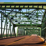 Originally built in 1905 with substantial repairs done over the years, the Lowry Avenue Bridge was closed on April 25, 2008. Controlled explosions demolished it on June 21, 2009.