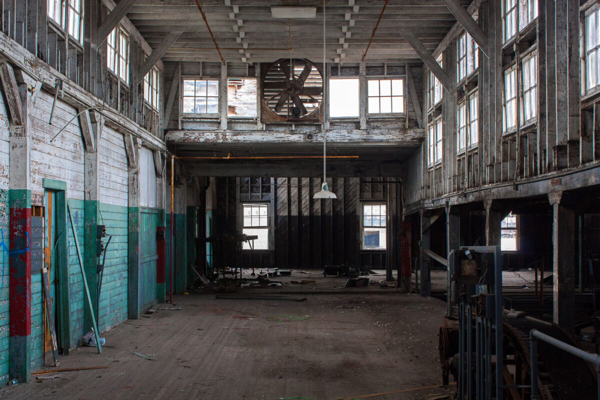 Interior of the abandoned Dixie Brewery in New Orleans, showing decay and debris within the industrial space.