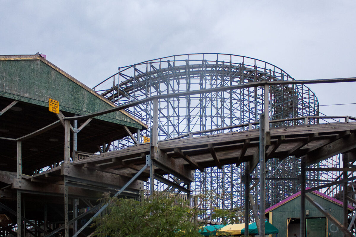 A damaged wooden roller coaster structure at Six Flags New Orleans, abandoned after Hurricane Katrina in 2005.