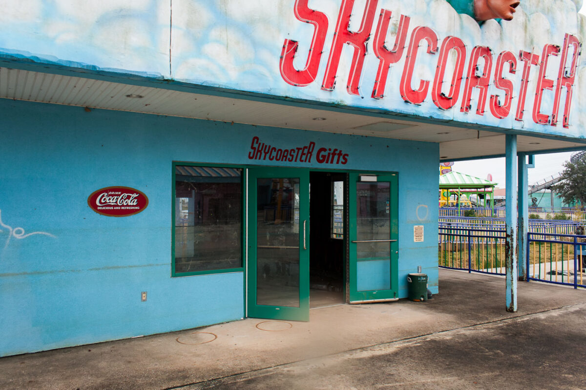 The "SKYCOASTER" gift shop entrance at Six Flags New Orleans, damaged after Hurricane Katrina in 2005. The park permanently closed due to storm damage.