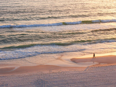 Lone Walker on Panama City Beach Shoreline