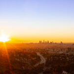 Sunrise behind Los Angeles as seen from Mulholland Drive.