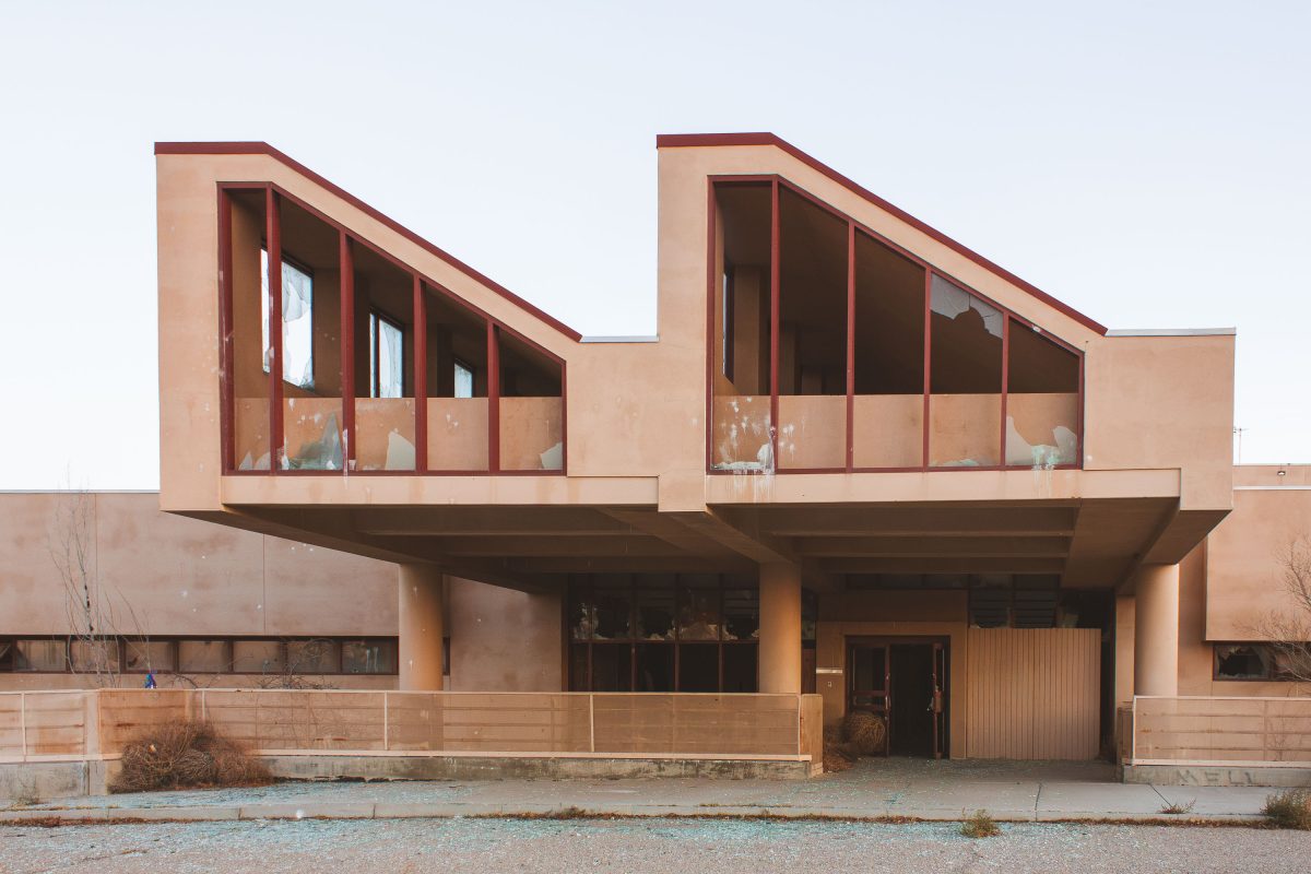 Abandoned modernist residential building with large windows at George Air Force Base in Victorville, California.
