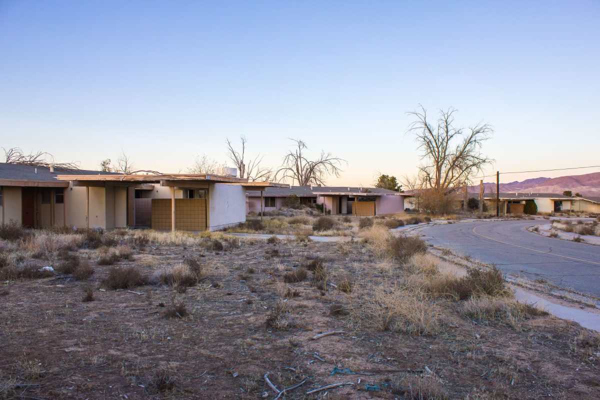 Abandoned residential buildings at George Air Force Base in Victorville, California at dusk.