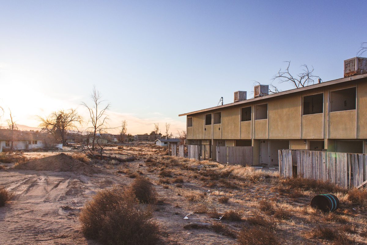 Abandoned residential building with boarded windows at George Air Force Base in Victorville, California.