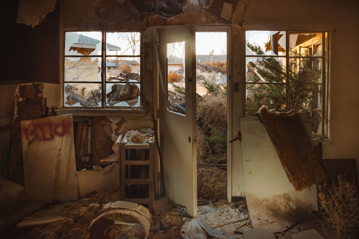 Deteriorated interior of abandoned residential building at George Air Force Base in Victorville, California.