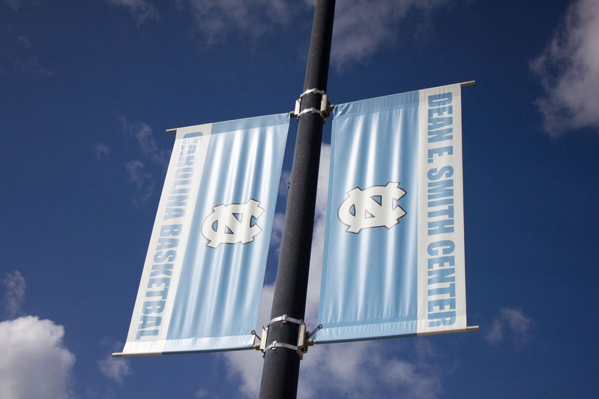 Banners at the University of Carolina that read Dean E Smith Center Carolina Basketball.