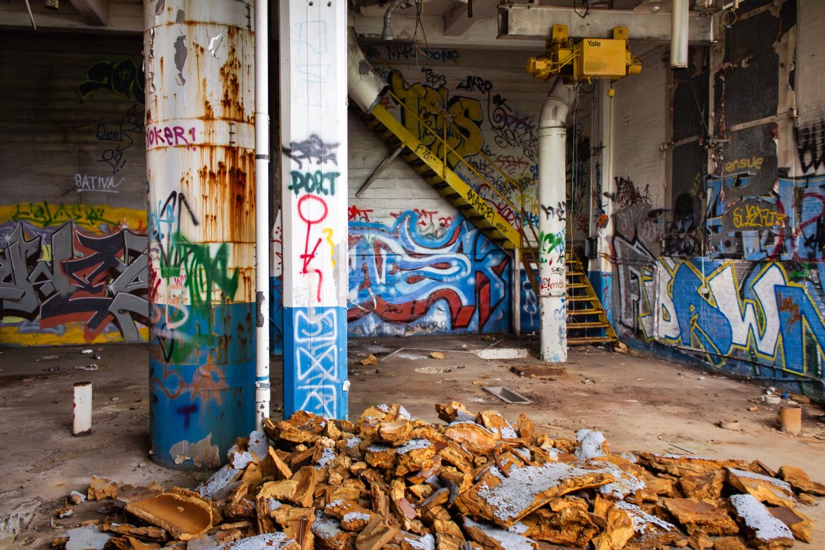 Abandoned Fruen Mill grain processing facility in Minneapolis with rusted industrial equipment, graffiti-covered walls, and
