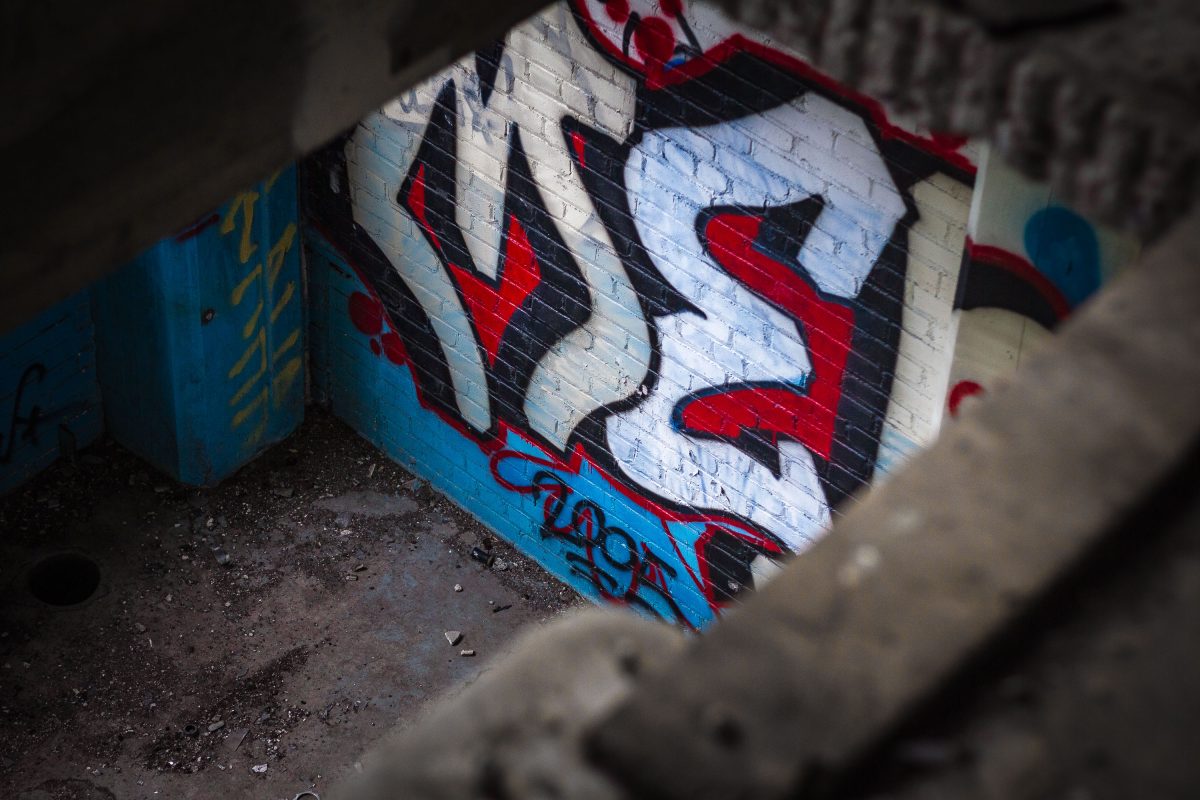 Colorful graffiti mural on concrete block inside the abandoned Fruen Mill grain processing facility in Minneapolis.
