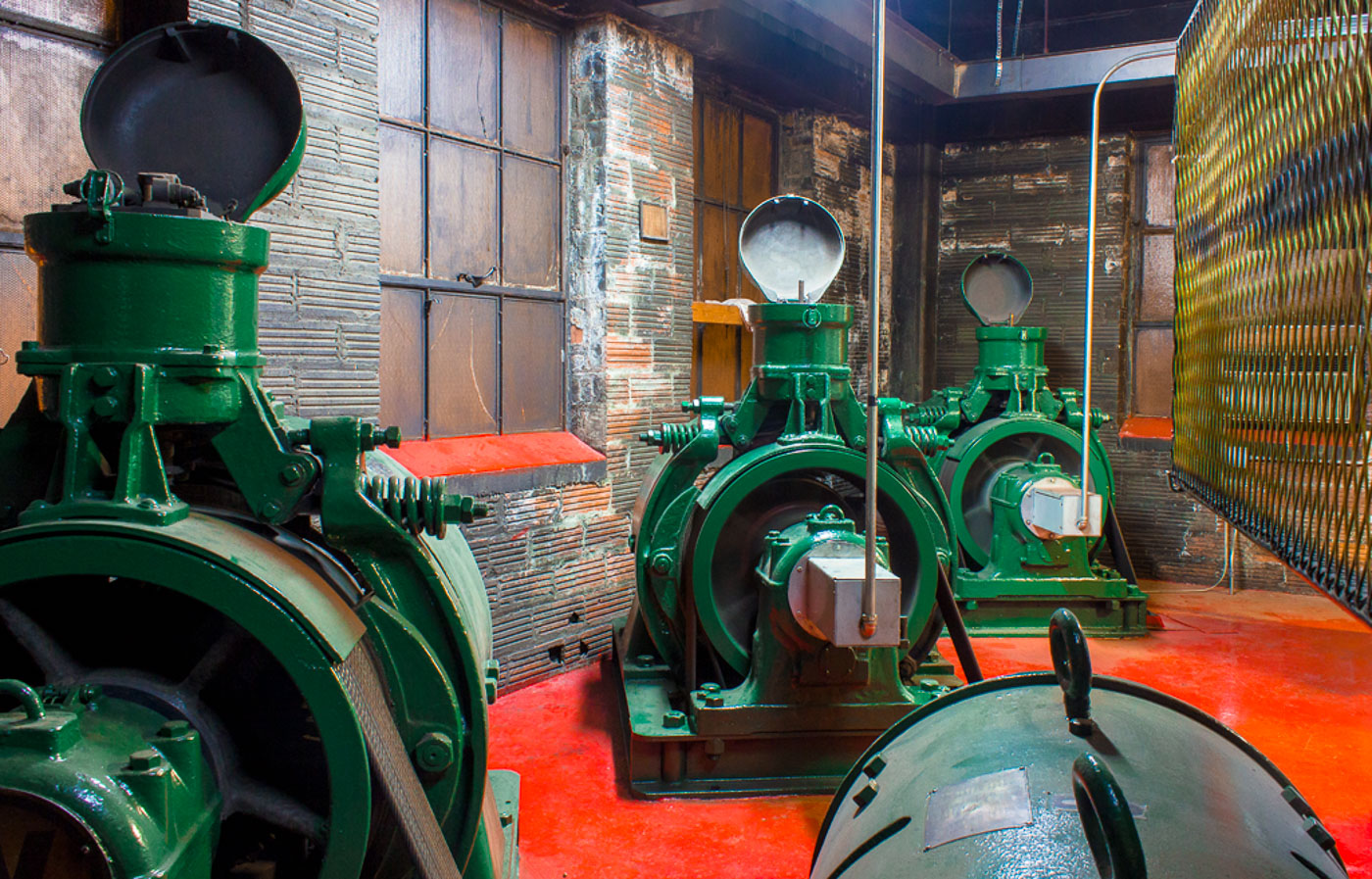 Historic green generators inside the Chicago Water Tower, a landmark structure built in 1869 that supplied water to the city and survived the Great Chicago Fire.