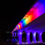 I-35W Bridge lit with rainbow colors.