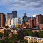 Downtown Minneapolis as seen from Loring Park in June 2013. Crane at the site of the under construction 36-story LPM Apartments building.