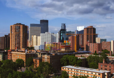 Downtown Minneapolis as seen from Loring Park in June 2013. Crane at the site of the under construction 36-story LPM Apartments building.
