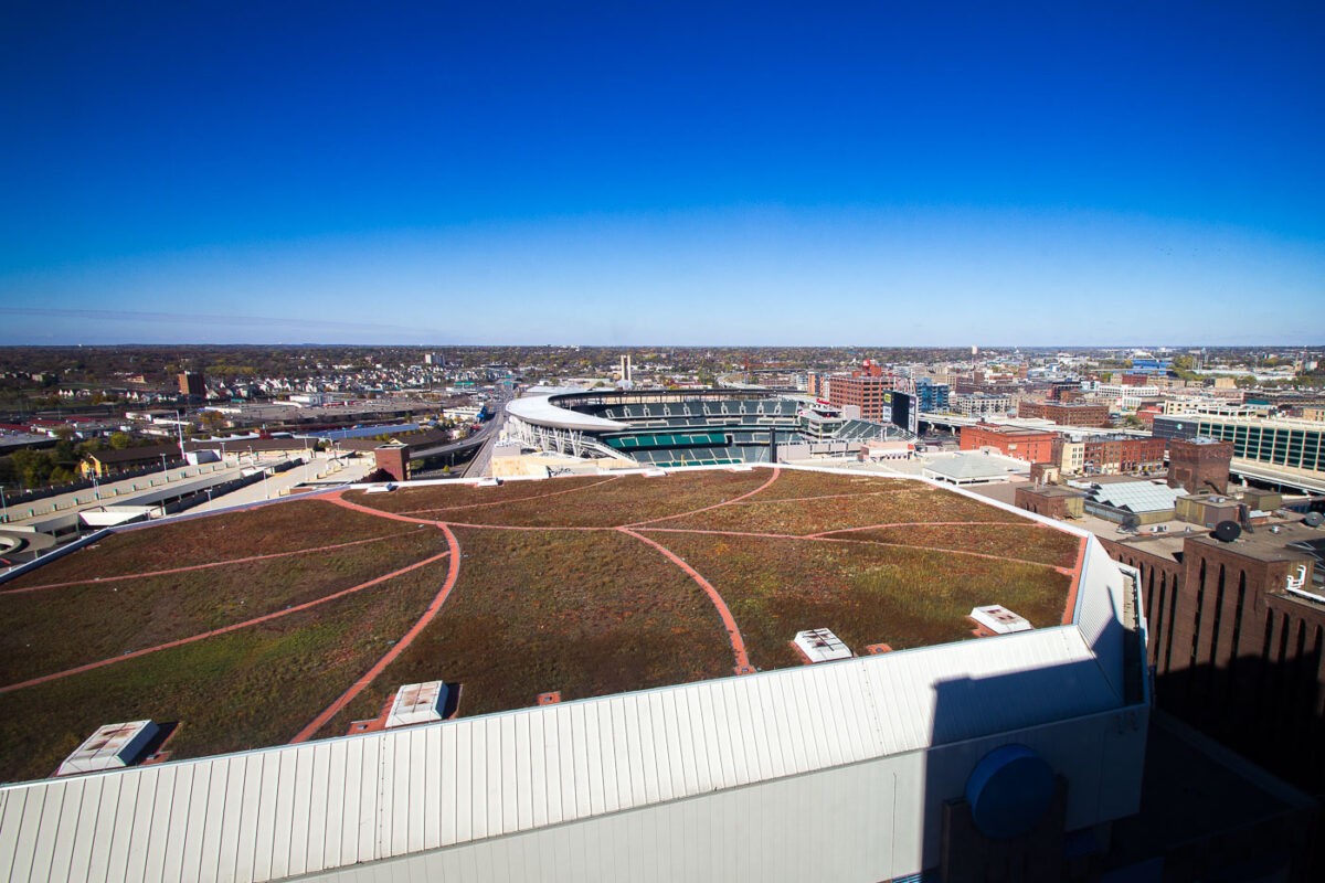 The green roof of the Target Center in Downtown Minneapolis with Target Field in the background.