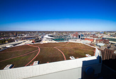 The green roof of the Target Center in Downtown Minneapolis with Target Field in the background.