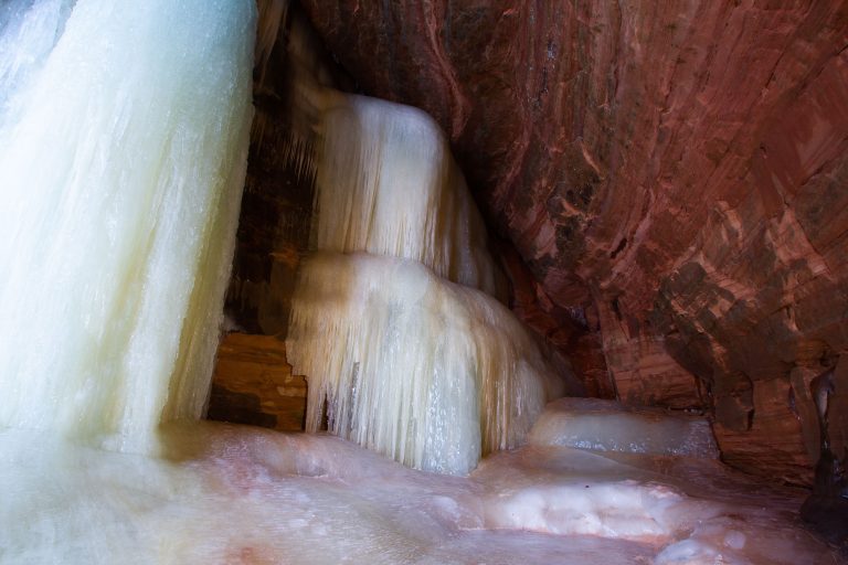 Frozen Ice Formations, Apostle Islands Mainland Sea Caves 3 Frozen ice formations coat sandstone walls inside the Apostle Islands Mainland Sea Caves on Lake Superior.