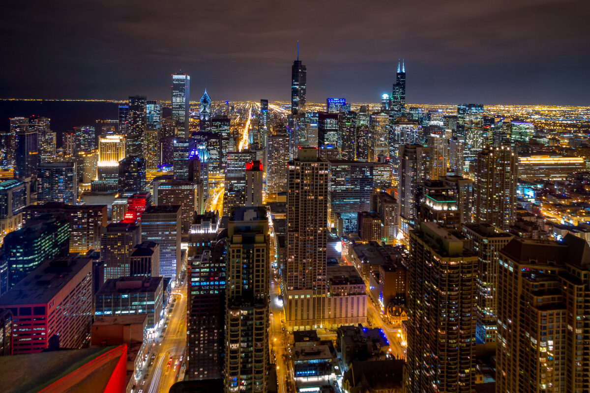A colorful photo of downtown Chicago buildings at night in 2014.