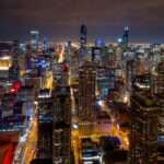 A colorful photo of downtown Chicago buildings at night in 2014.
