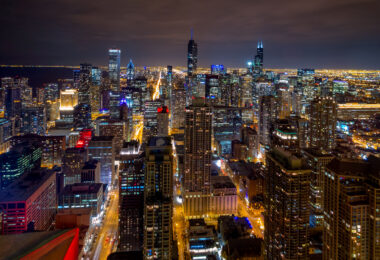 A colorful photo of downtown Chicago buildings at night in 2014.