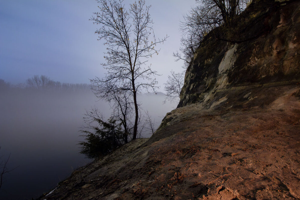 The sandstone bluffs of St. Paul, Minnesota with a foggy Mississippi River.