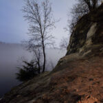 The sandstone bluffs of St. Paul, Minnesota with a foggy Mississippi River.