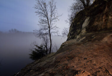 The sandstone bluffs of St. Paul, Minnesota with a foggy Mississippi River.