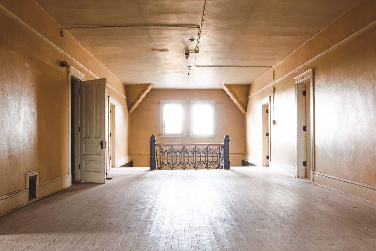 Attic hallway with iron railing, Fergus Falls Kirkbride Building