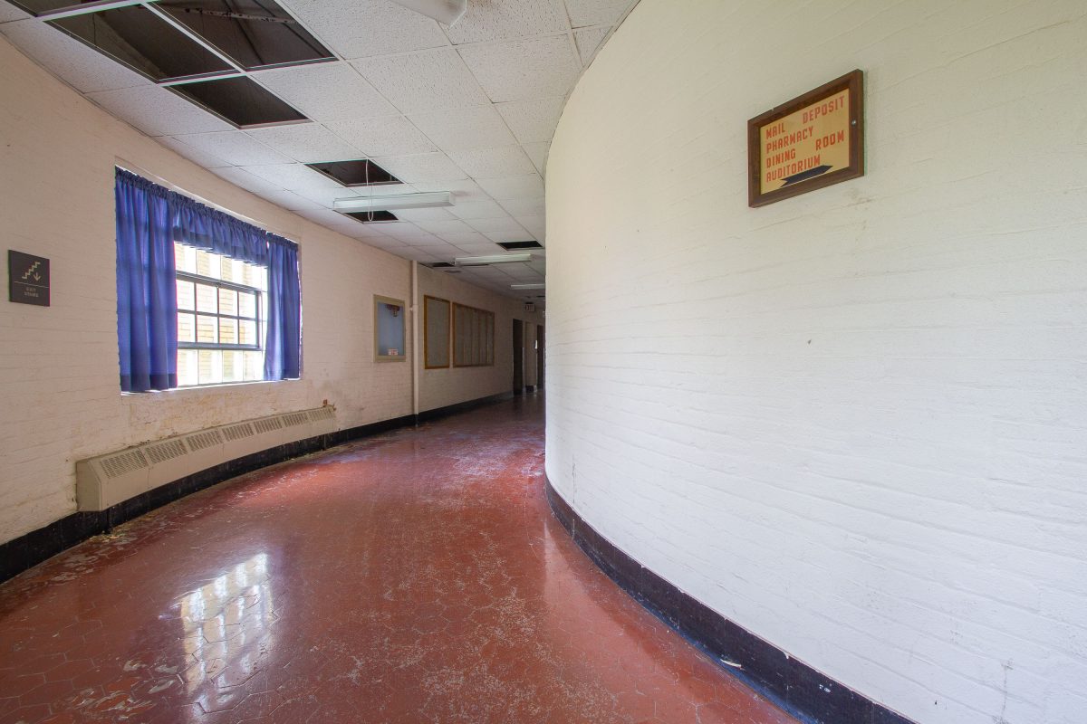 Directional Sign in Curved Corridor, Fergus Falls Kirkbride Building, Minnesota
